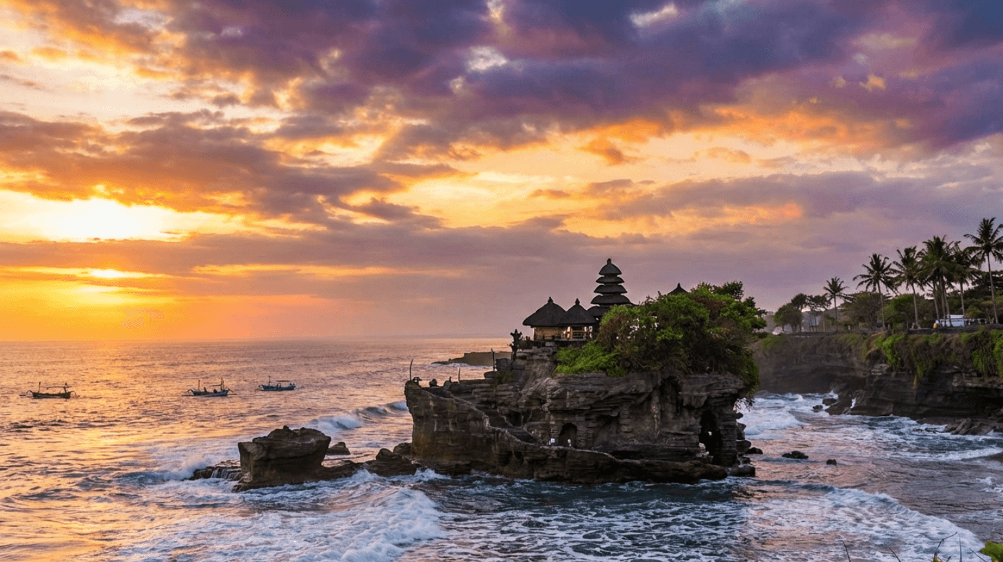 Tanah Lot Temple perched on rocky coastline during sunset in Bali, Indonesia
