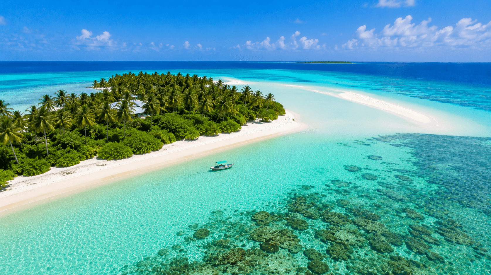 Lakshadweep Tour Package from Kerala 2026 featuring an aerial view of a tropical island with turquoise lagoon, white sandbanks, coral reefs and coconut palms